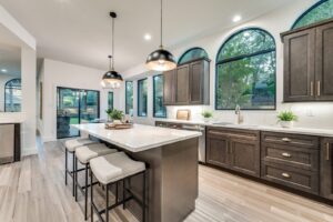 Remodeled kitchen with large island and custom cabinetry in McKinney, TX