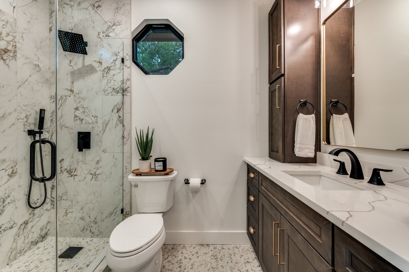 Bathroom remodel with marble tile shower surround