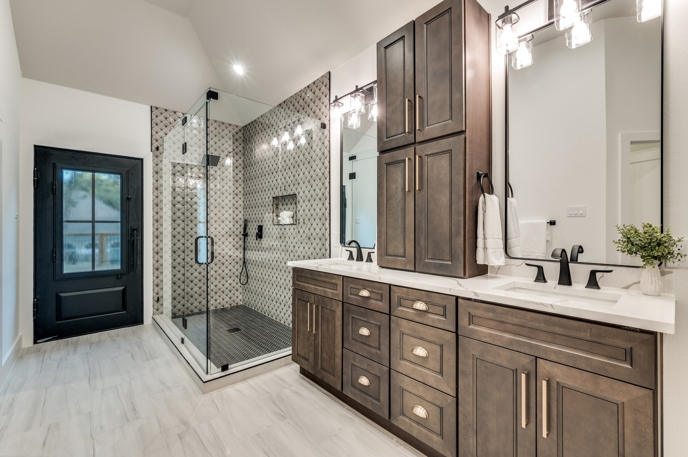 Primary bathroom remodel with double vanity and tiled walk-in shower in a Dallas-Fort Worth home