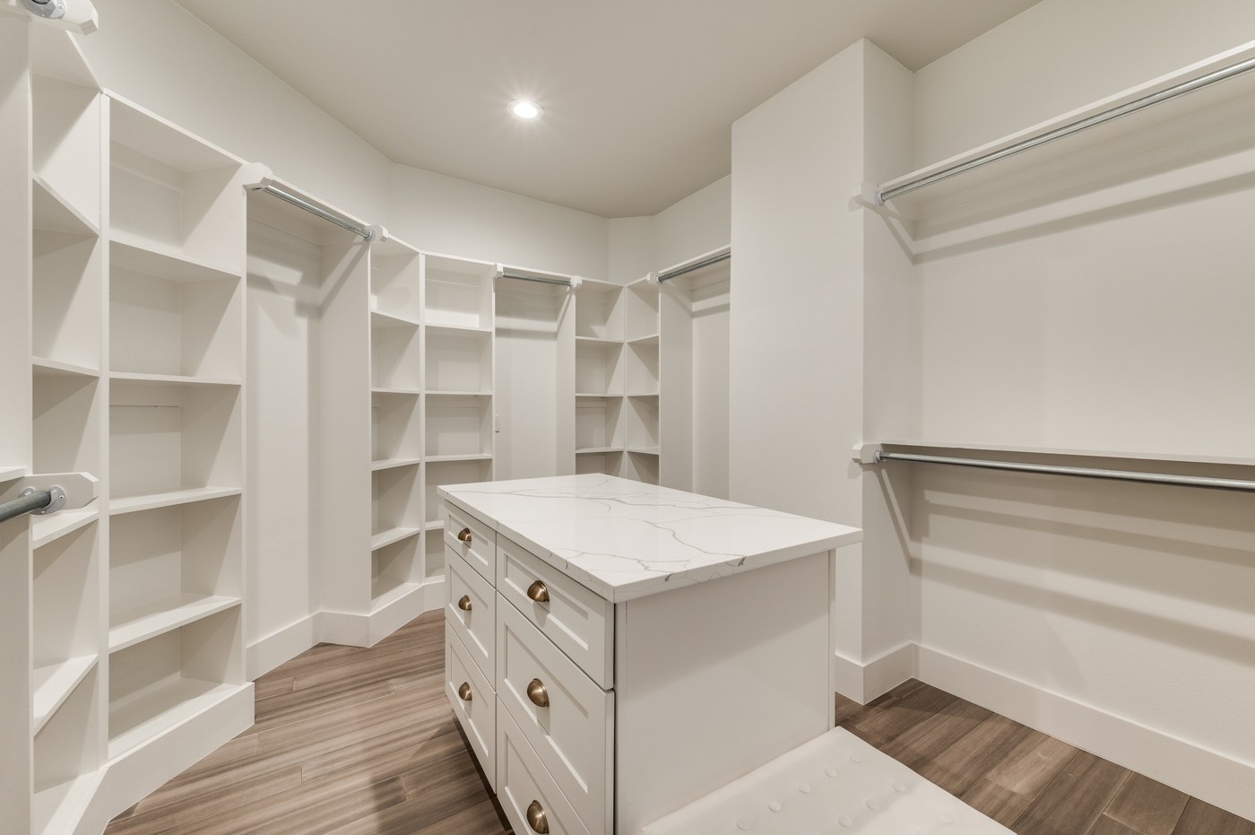 Custom closet build-out with built-in shelving and drawers