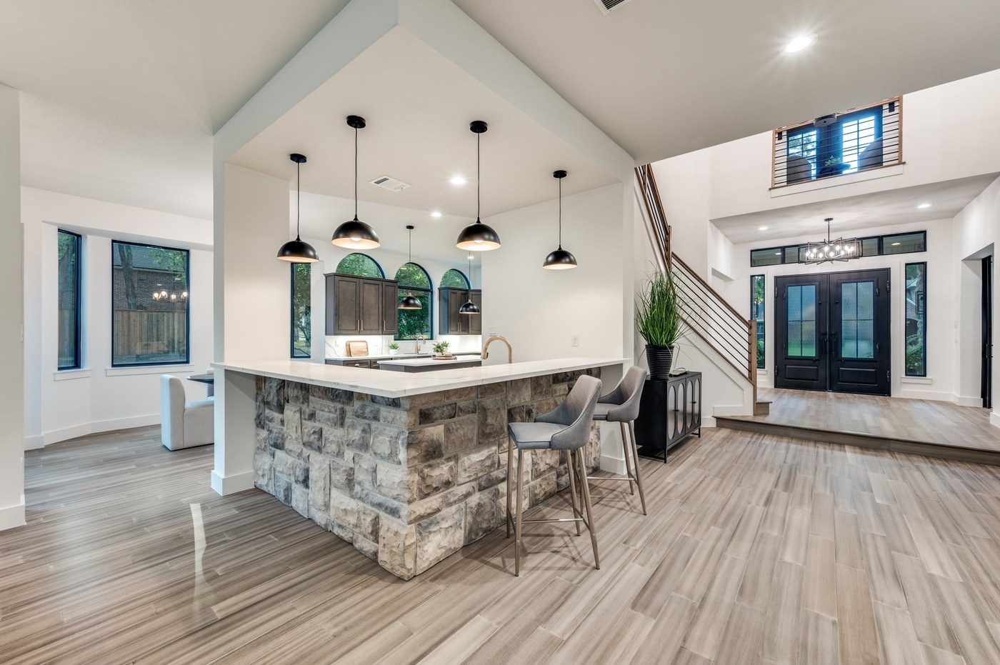 Kitchen bar seating with stone detail in a DFW home renovation