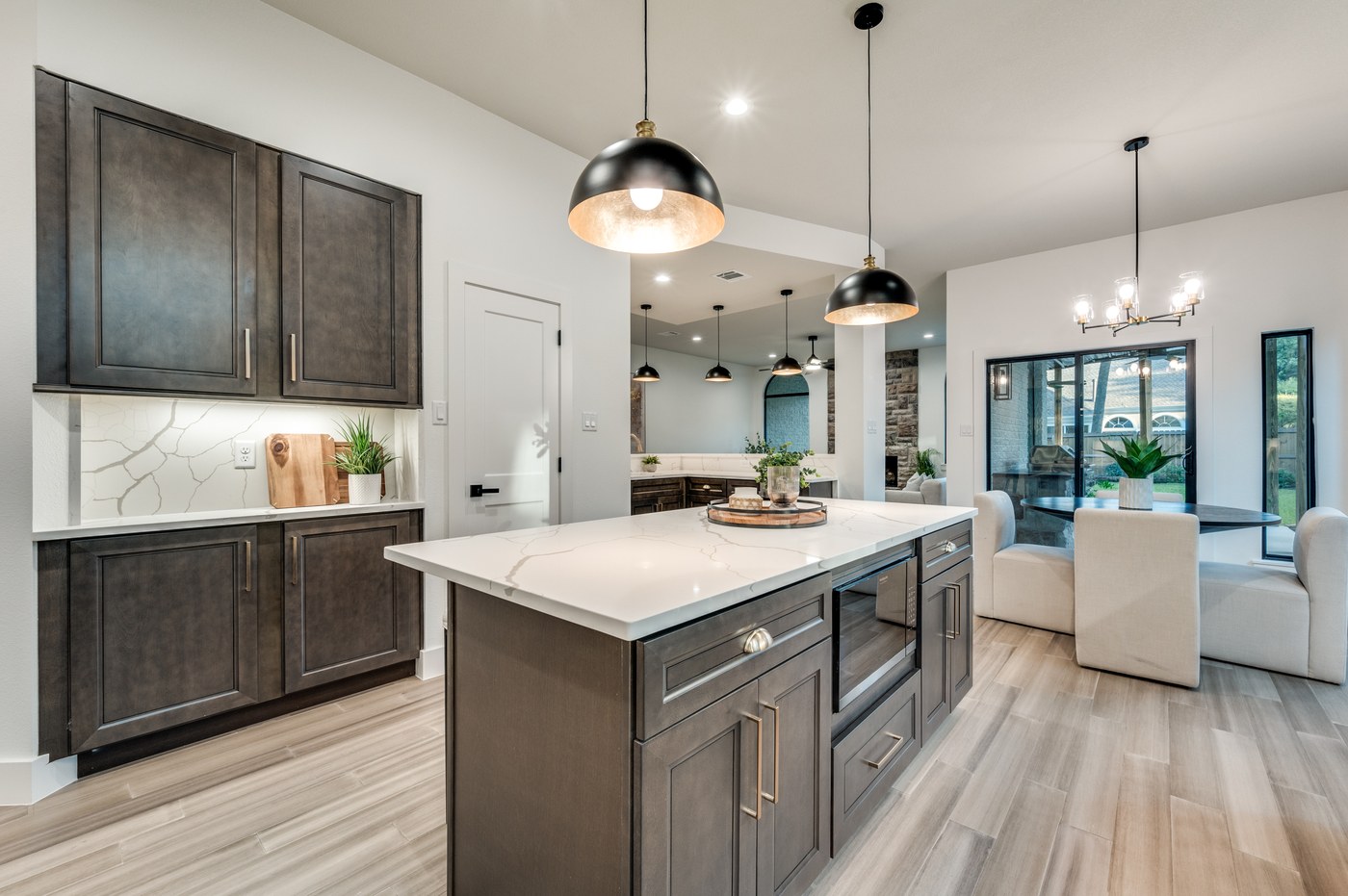 Remodeled kitchen with large quartz island in a McKinney, TX home