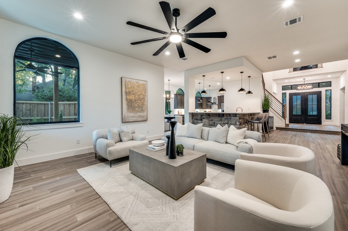 Open concept living room with vaulted ceiling after renovation
