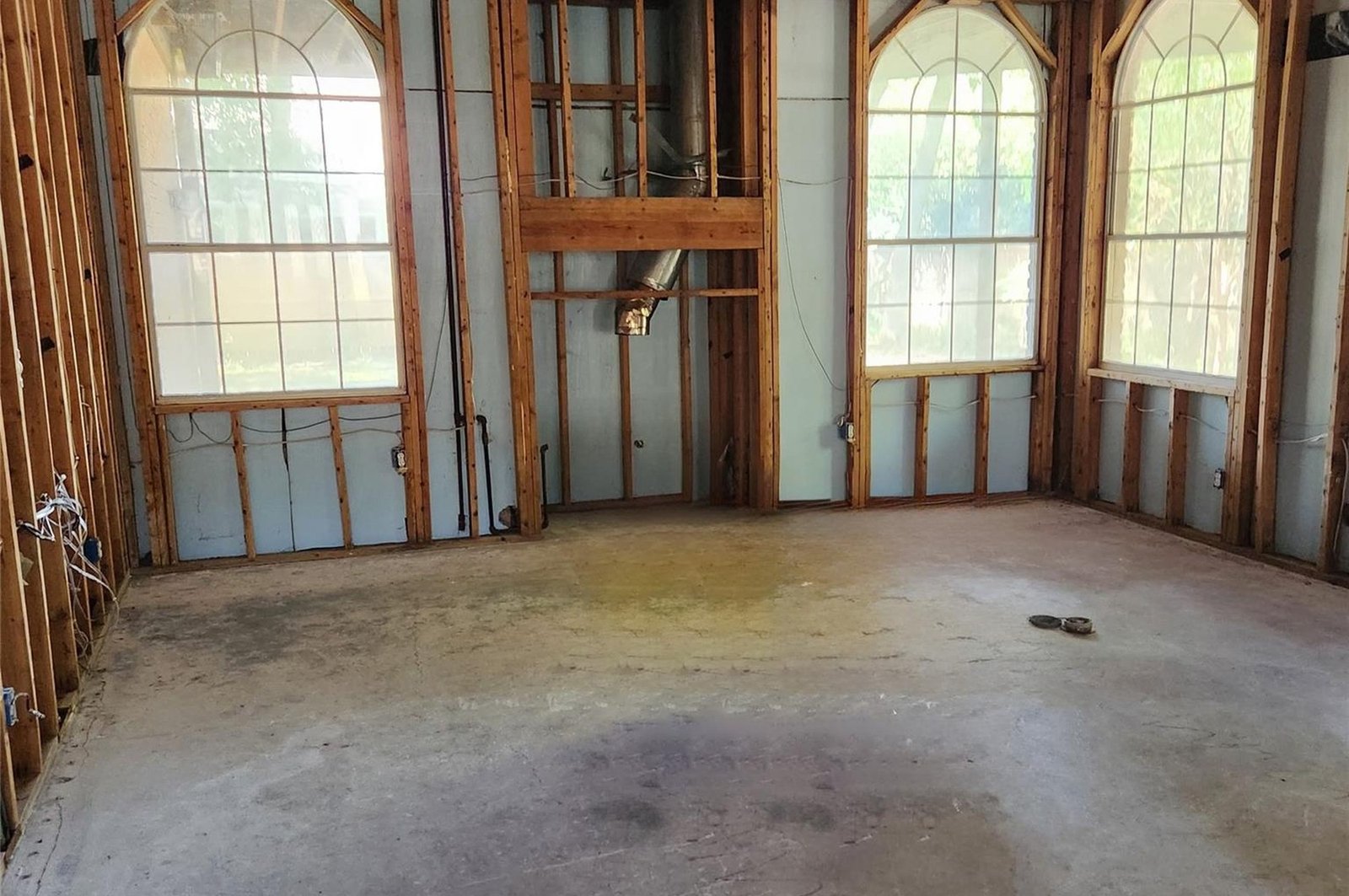 Family room framed to studs during renovation in McKinney, TX