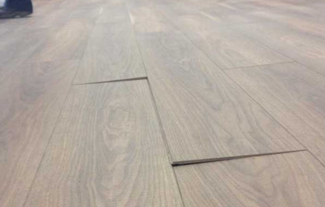 Laminate flooring planks lifting and separating at the seams