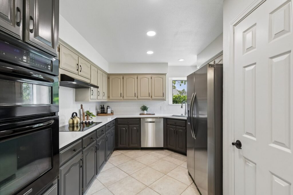 Kitchen after cabinet painting with two-tone painted cabinets